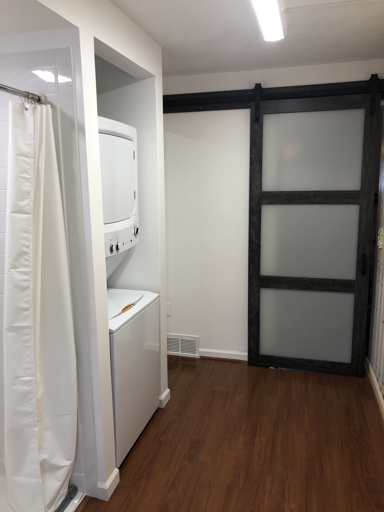 A laundry room after being reformatted into a new, accessible bathroom.