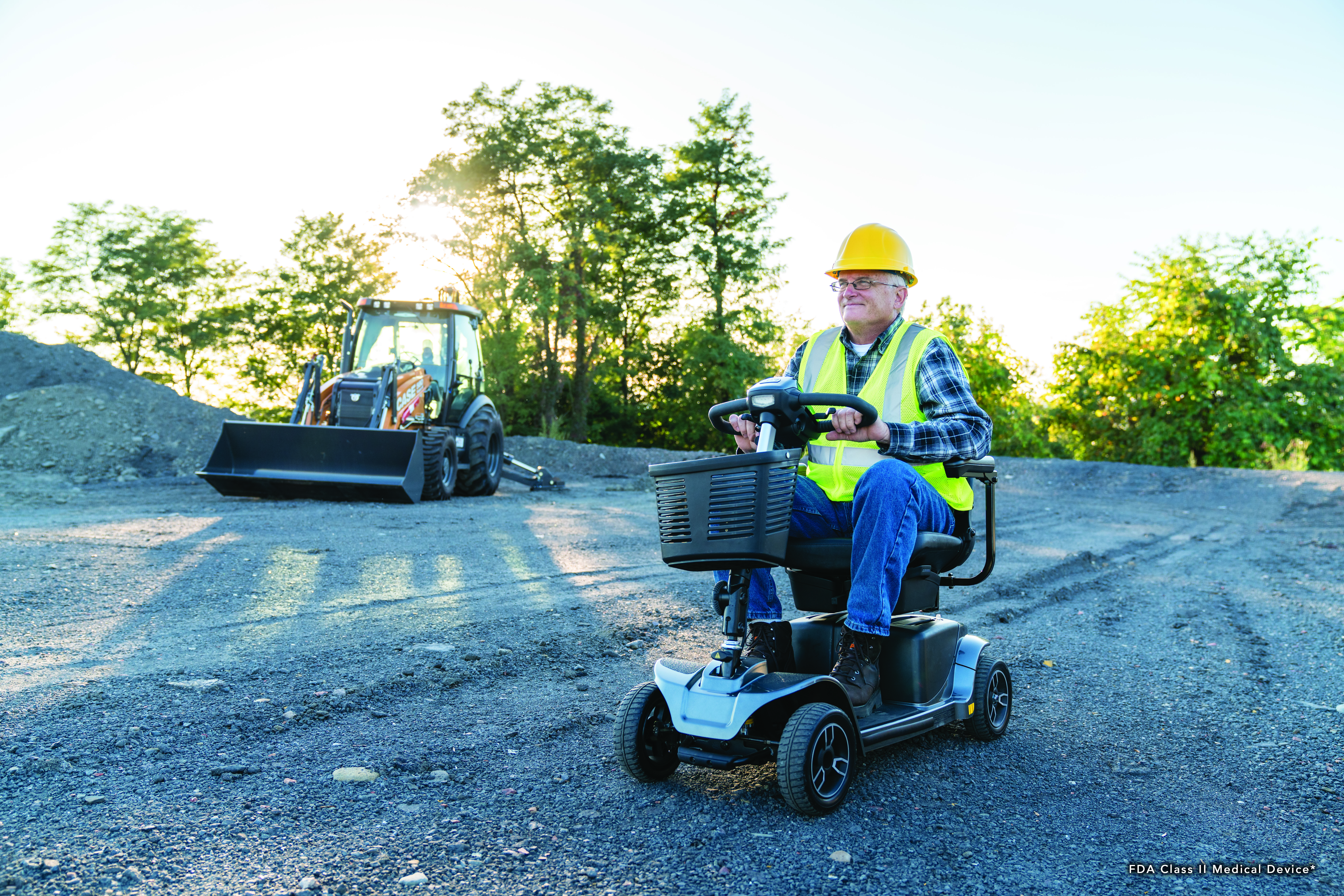 A man using his electric scooter on a job site.