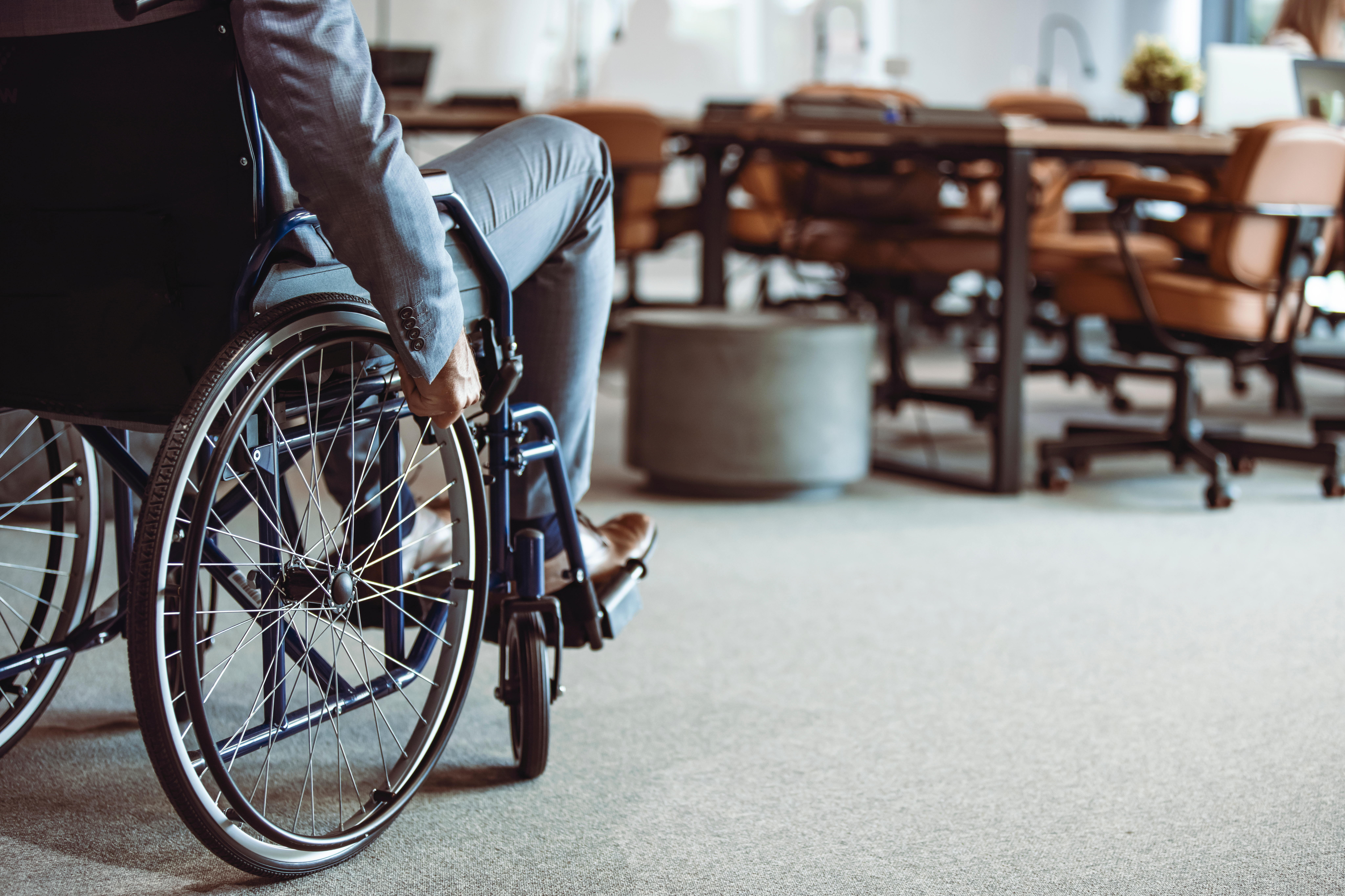 person in wheelchair in a workplace